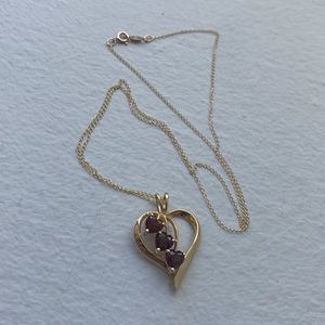 Beautifuly designed Heart shaped pendant with 3 heart-cut Garnets on a  necklace